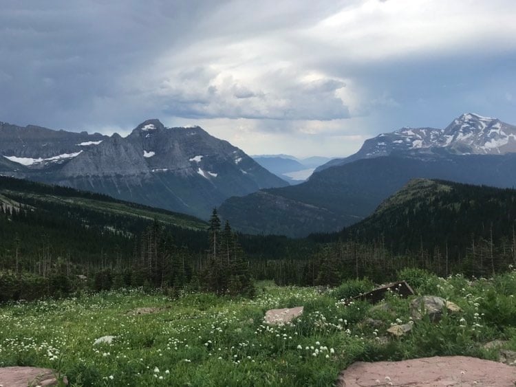 lake mcdonald peeking out between two mountains