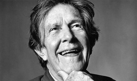 A photo of the avant-garde composer John Cage, smiling