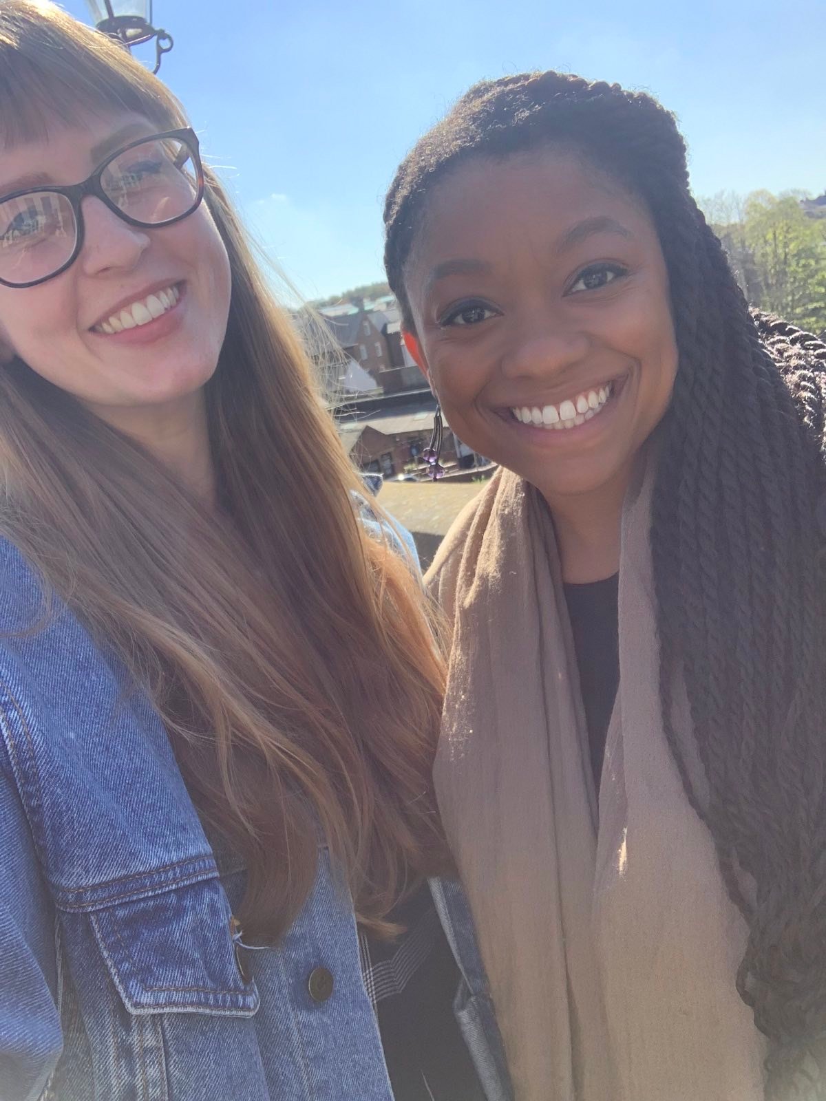 Photo of myself and Abbie, side-by-side, smiling at the camera.