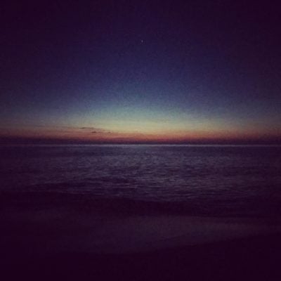 The sun peaking its head up on the horizon around 4 am