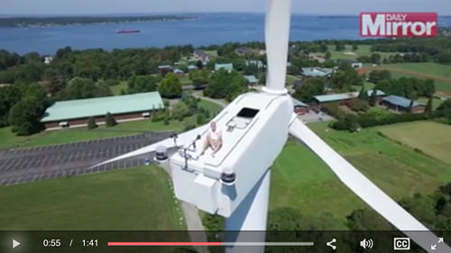 Sunbathing on Top of Wind Tower [enable images; click to view]