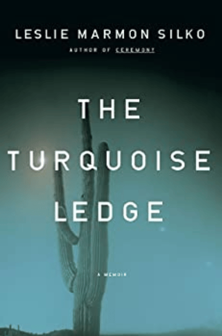 Book cover of Leslie Marmon Silko's Memoir a blue background with a tall saguero cactus behind white title reading: The Turquoise Ledge