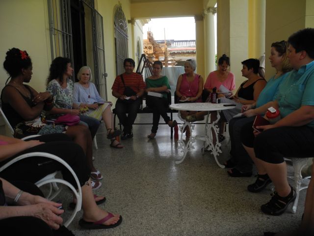 A group of women gathered in an outdoor setting discussing abortion