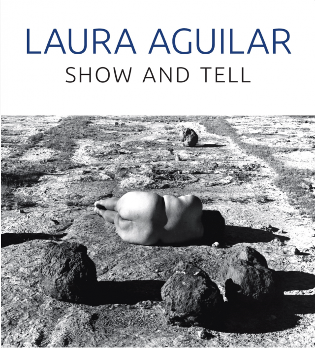 book cover of Laura Aguilar: Show and Tell featuring a black and white photo of a light brown skinned Chicana laying naked in a landscape next to boulders