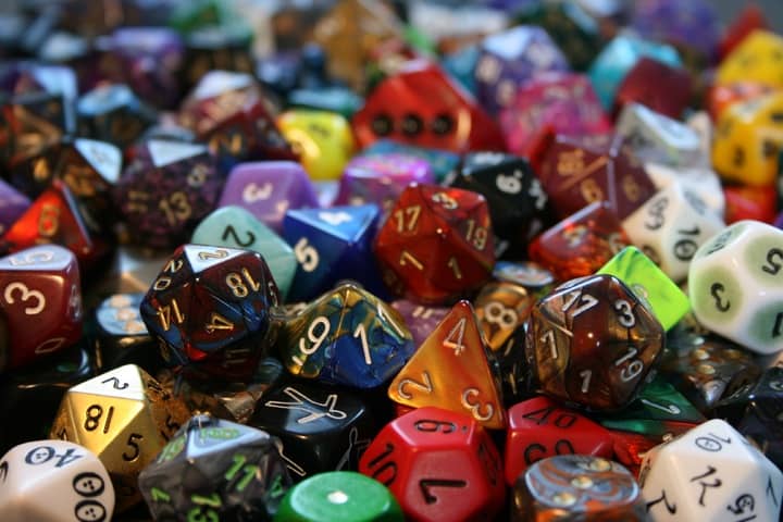 Photo of a pile of various dice used in tabletop gaming.