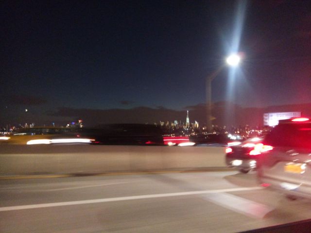 Speeding cabs and Manhattan in the far distance
