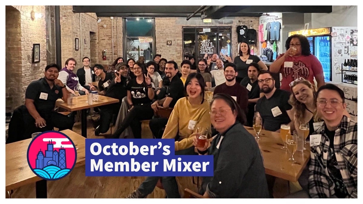 Photo of our October Member Mixer gathering – 20+ people smiling at the camera
