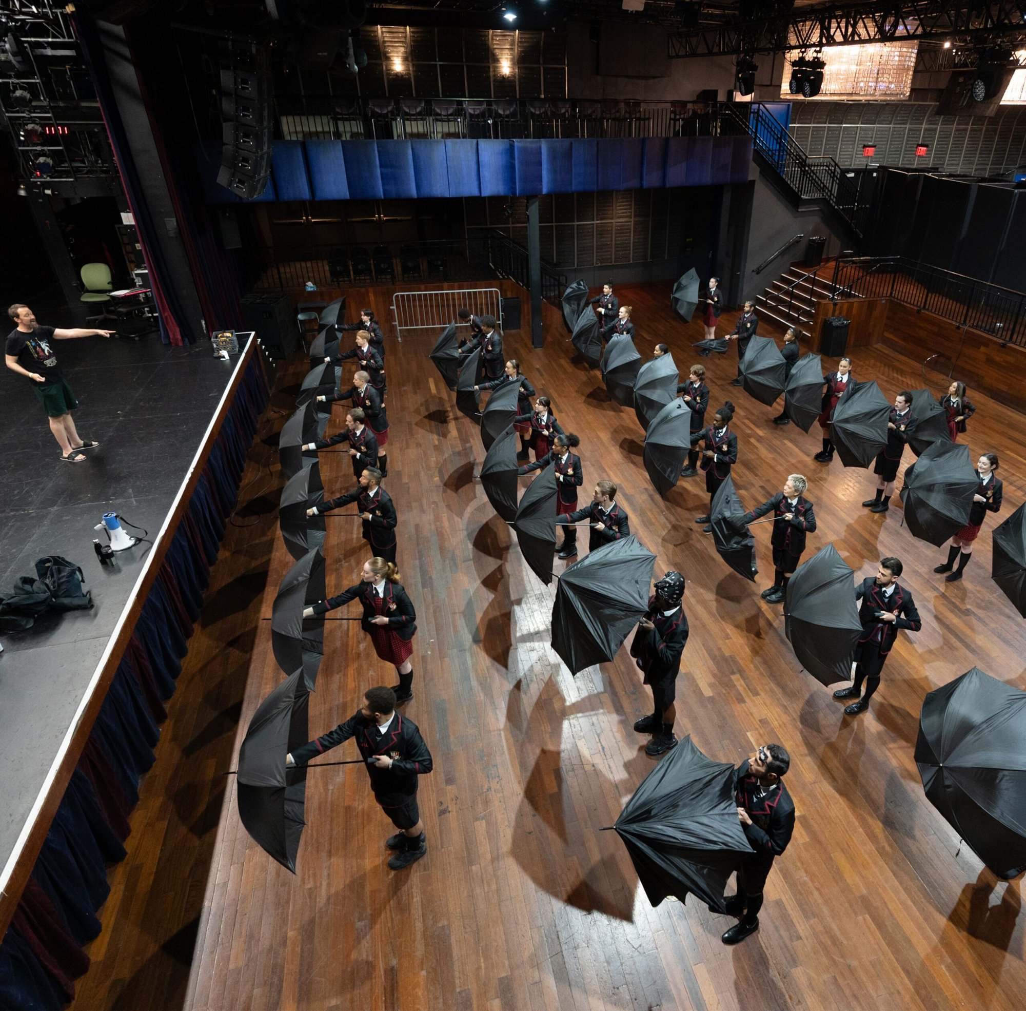 dancers rehearse with umbrellas