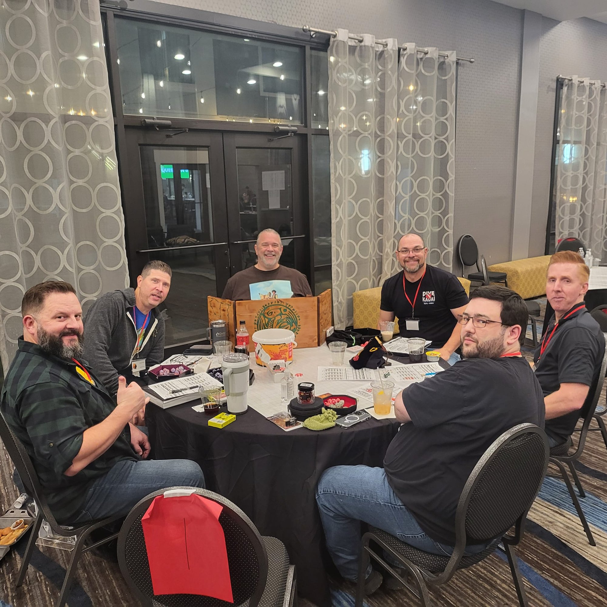 May be an image of 5 people, table and text May be an image of 5 people, table and text