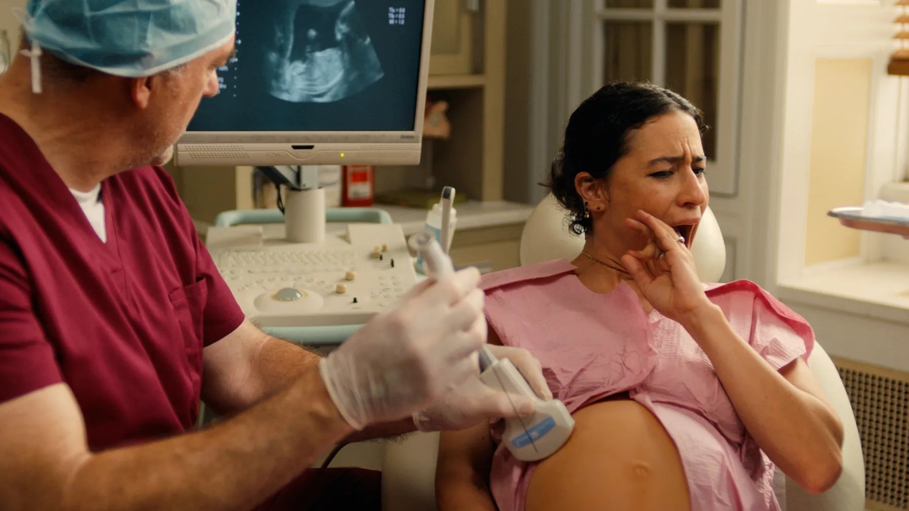 Eden cringes away from the amnio needle at her appointment