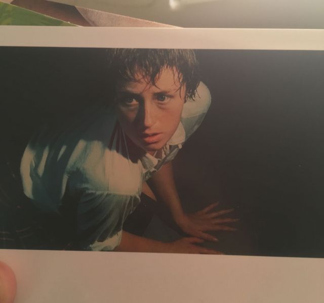 A close up of the postcard. It's definitely a photograph and not a painting.