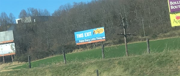 A Cracker Barrel restaurant billboard, from somewhere on interstate 81 in southwestern Virginia, proclaiming ENJOY EVERY LITTLE THING. I do, Cracker Barrel. I really do.
