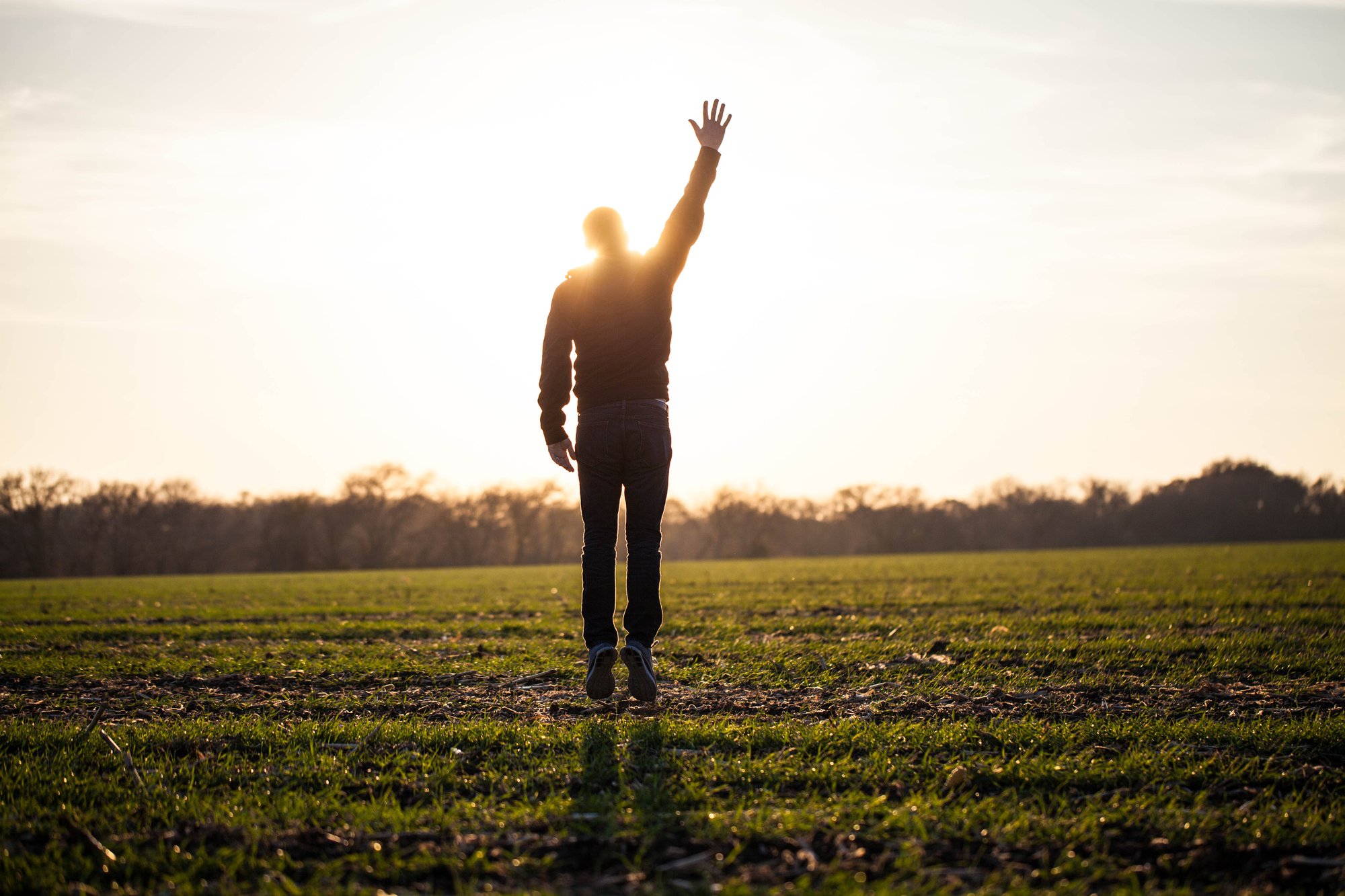 hand raised in field - lightstock_57774_medium_user_1230963