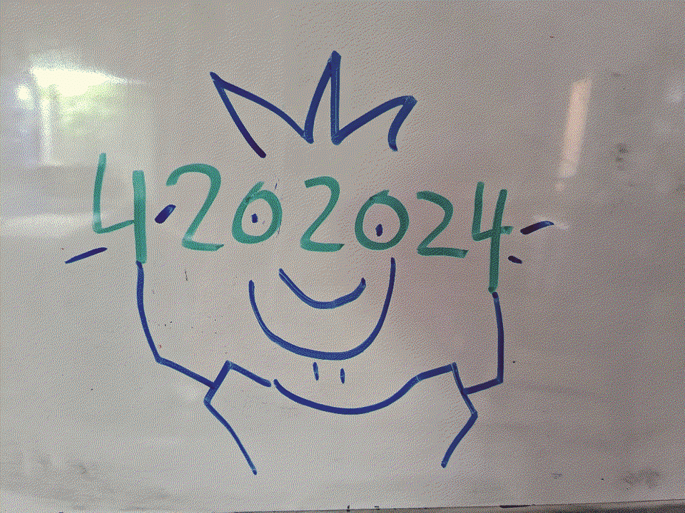 A whiteboard drawing: the numbers 4202024 with the 0s forming the eyes of a smiling cartoon fella.
