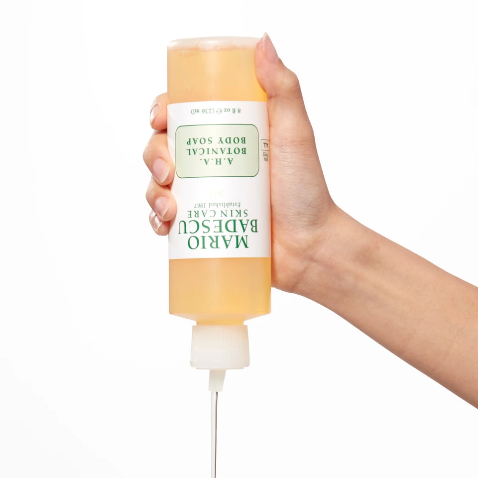 A bottle of Mario Badescu aha botanical body soap