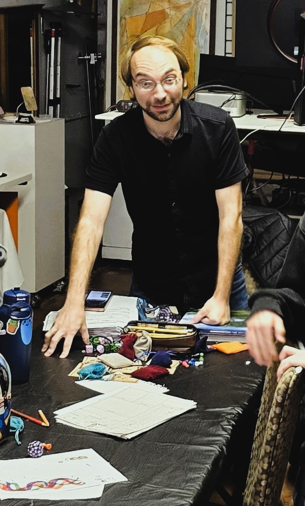 Sam Tillis, surprised by a photo, mid-D&D session.