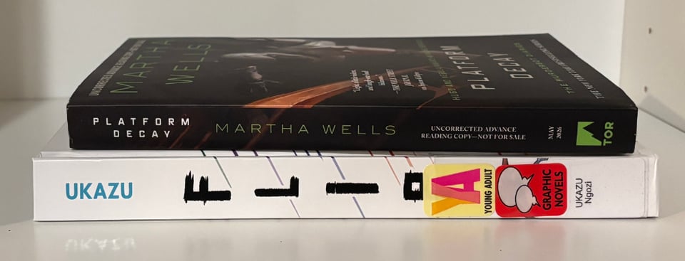 stack of books: advanced reader copy of Platform Decay by Martha Wells, Flip by Ngozi Ukazu