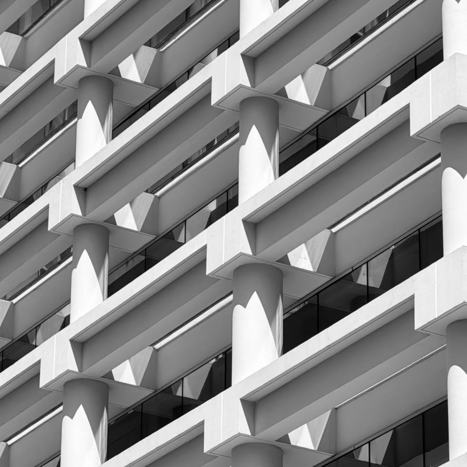 An office building with an ornate concrete facade.