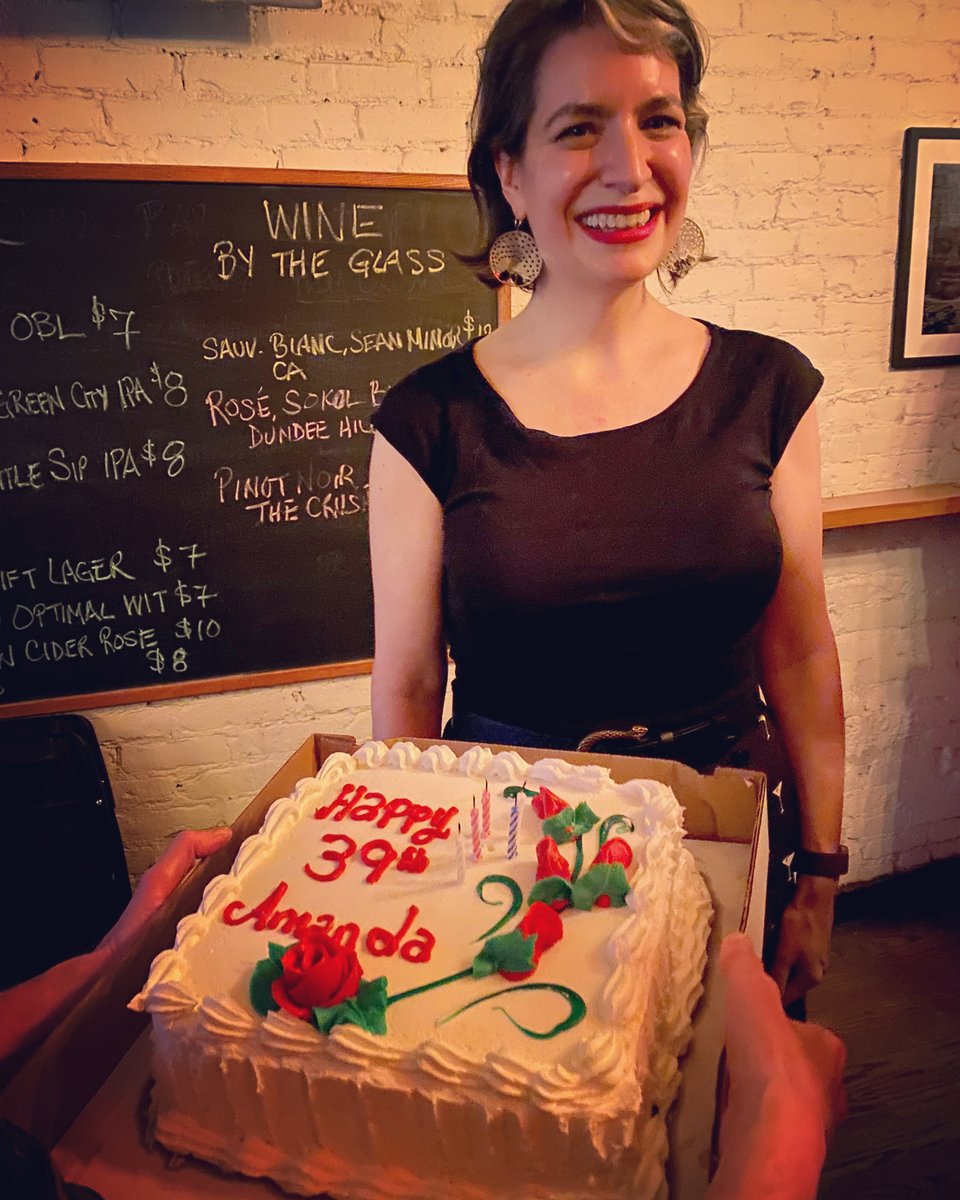 "Happy 39th Amanda" cake presented at a bar
