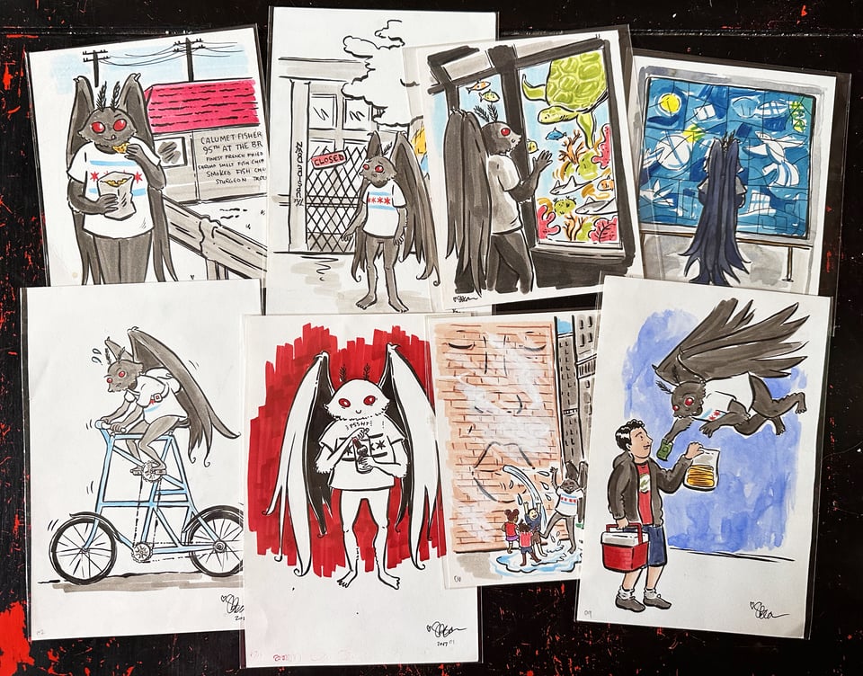 a handful of the original mothman drawings on a tabletop