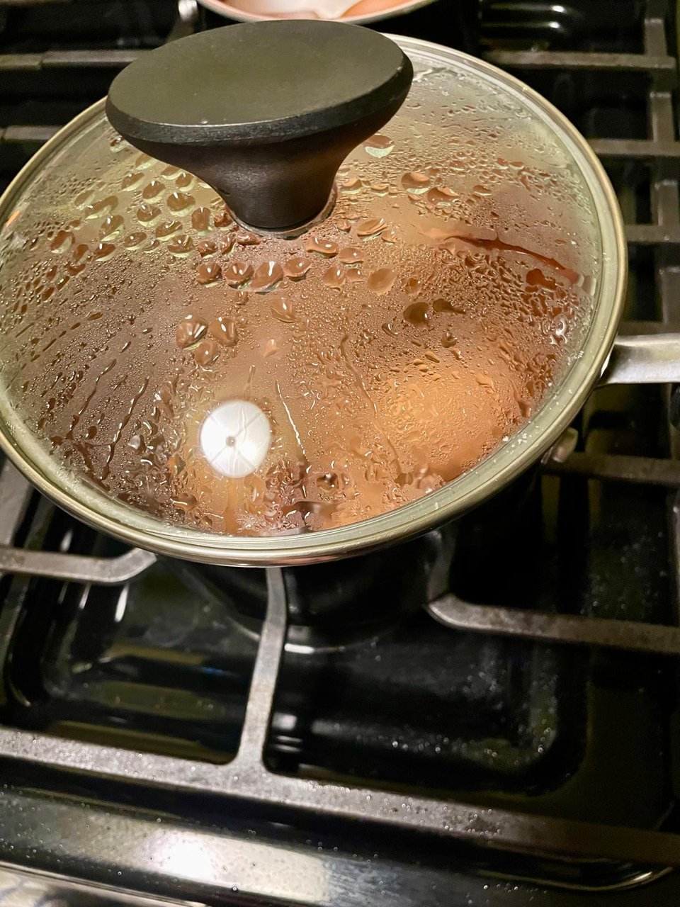 A lidded pan with eggs in