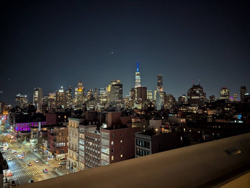The lights of New York City viewed from a rooftop deck