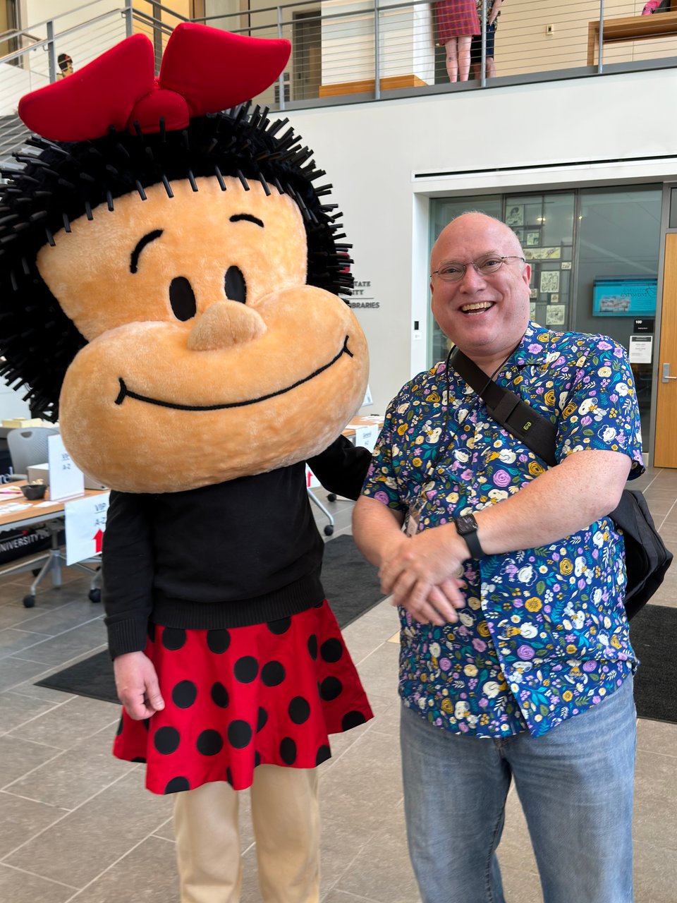 Photo of Glenn Fleishman (right) posing at the Billy Ireland Cartoon Library & Museum with someone in a Nancy costume with an oversized plush head