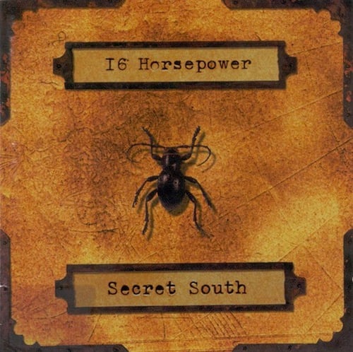 The cover of 16 Horsepower’s SECRET SOUTH, which is orange/brown, has the band and album title in what look like file drawer label, with a black beetle in the middle.