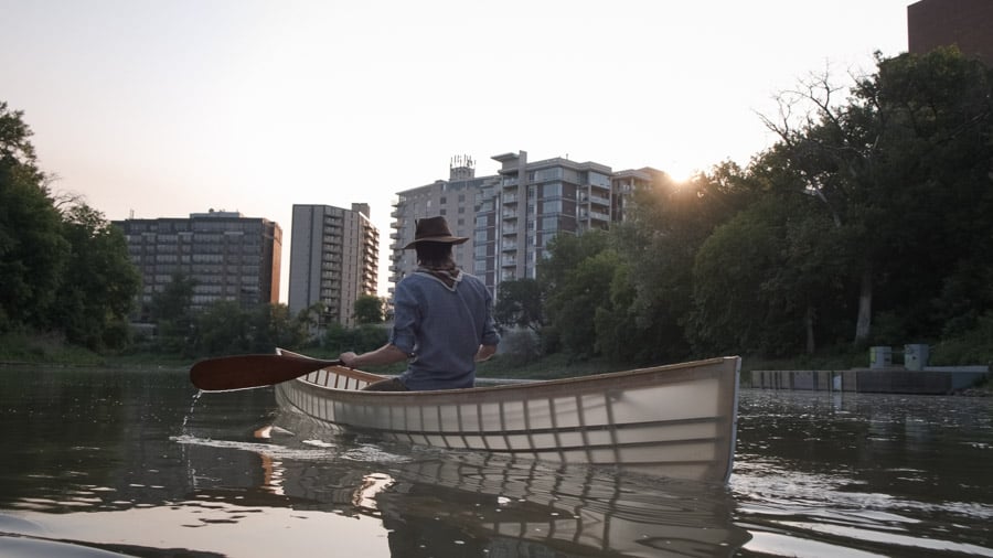 01 - Canoer paddling along the Assiniboine River in Winnipeg at sunrise