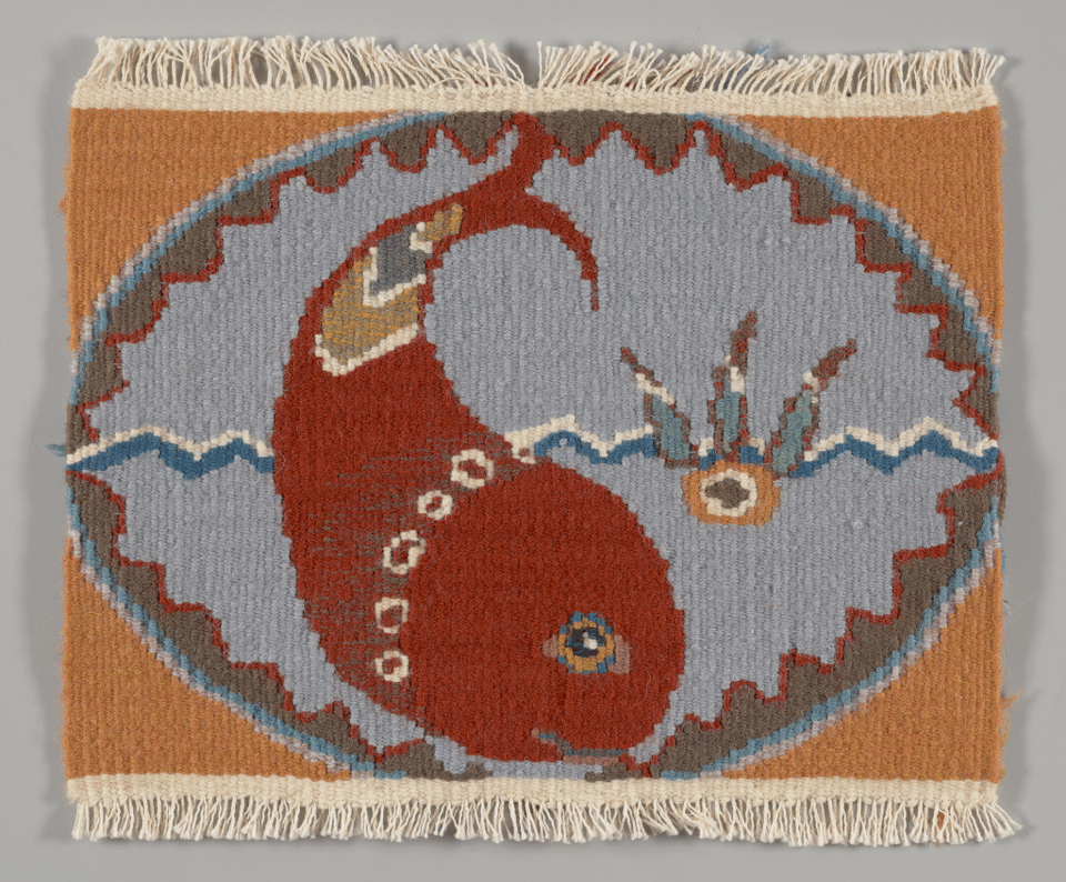 a weaving of a stylized sea creature and decorative elements