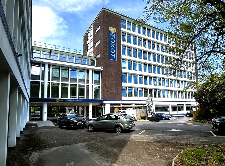 A panel system building made up of two blocks connected by a smaller entranceway. The entranceway is mostly glass, with piloti, whilst panels are concrete with windows inset.