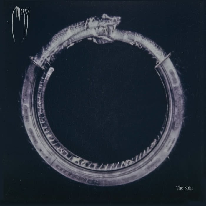 The cover of "The Spin", a black and white image of a ring with a snake head.