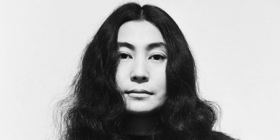 A black and white picture of the artist, Yoko Ono.
