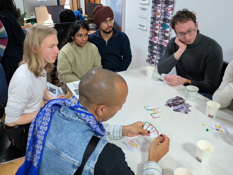 A group of players test out the card game LINKS