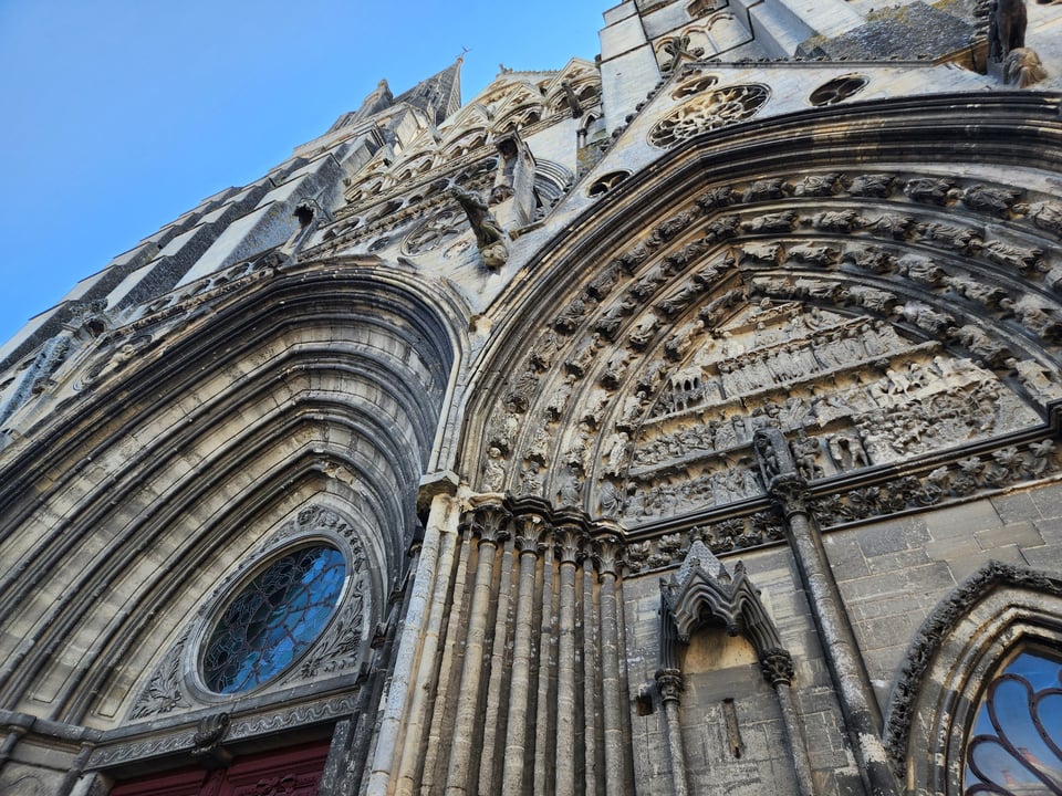 Romanesque carvings over a cathdral door.