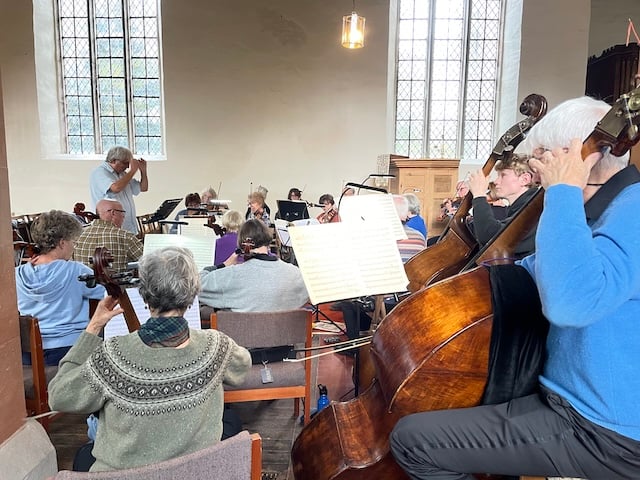 An orchestra rehearsing.