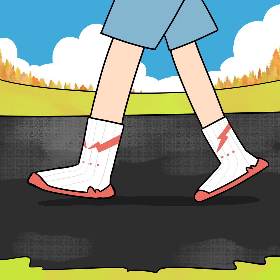 A person is walking down a path wearing a kind of combination shoe and sock.