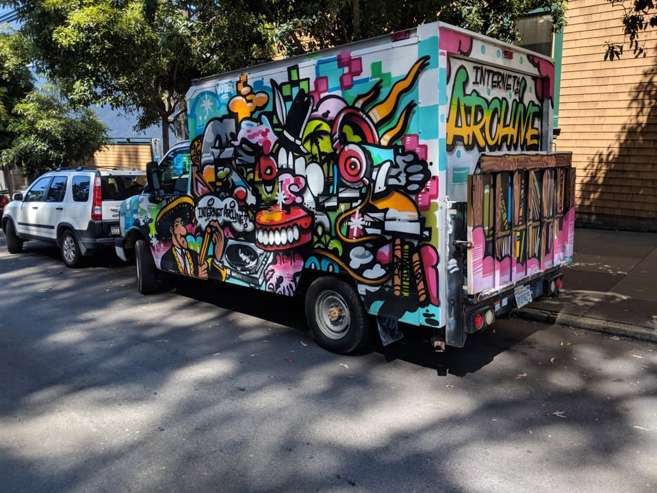 A van for the Internet Archive, painted with lots of colorful graffiti