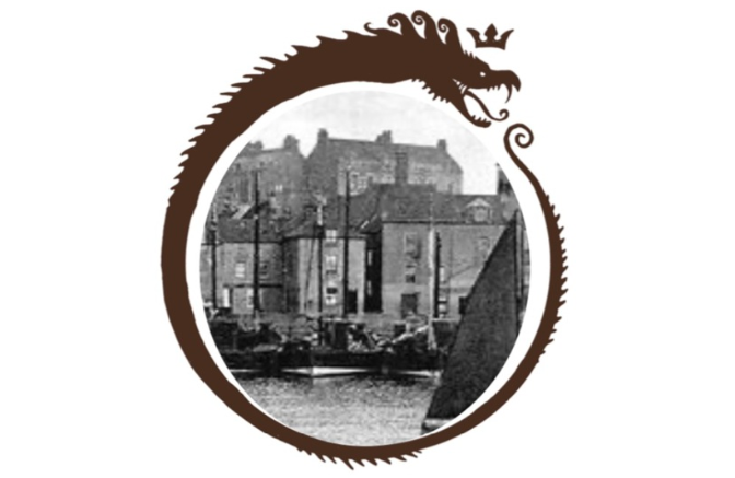 A serpent like beats frames a circular picture of a black and white Scottish seaside town.