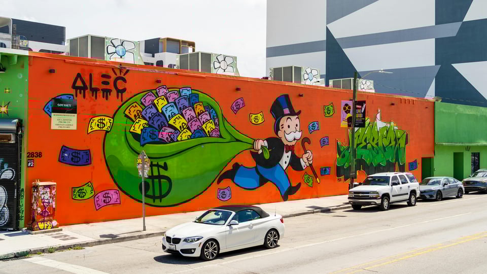 The Monopoly Man running away with all the money, painted on a mural