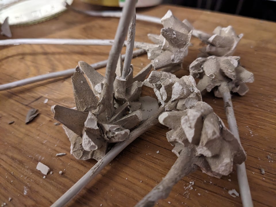 Closeup of molded plaster mimicking moss, with most tips cracked off