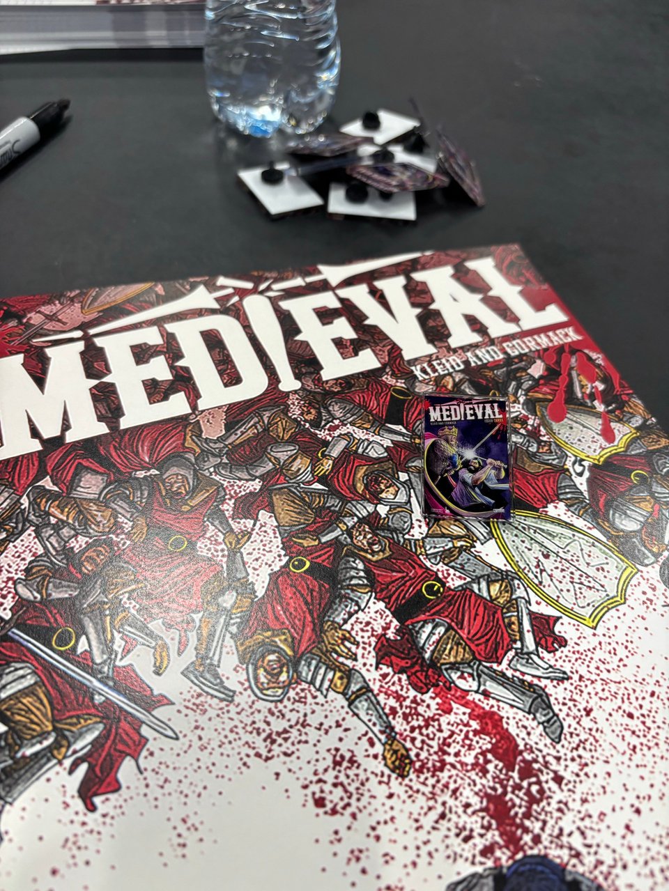 medieval posters and pins at nycc 2025