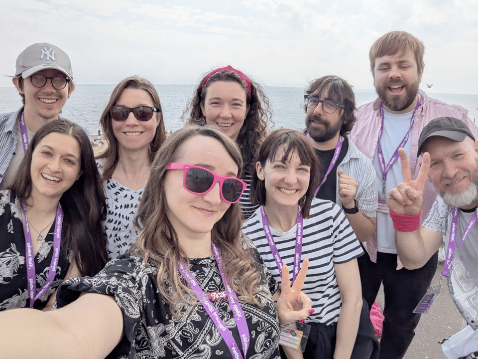 9 people taking a selfie by Brighton Beach