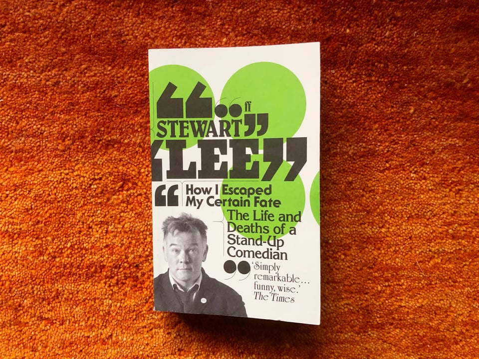 Photograph of the book, How I Escaped My Certain Fate (The Life and Deaths of a Stand-Up Comedian' by Stewart Lee. The cover includes a black and white photograph of the author.