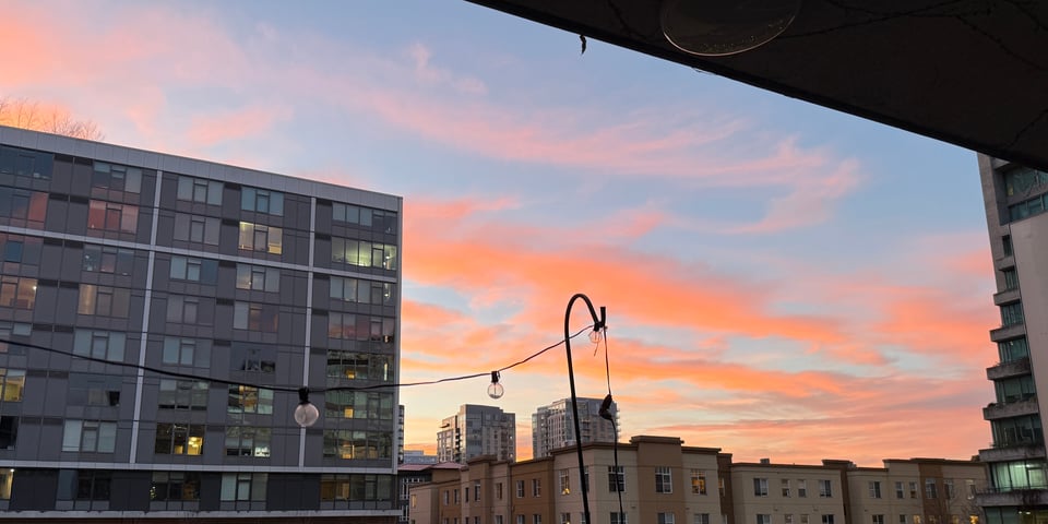 Beautiful orange streaked sunset clouds over a blue sky