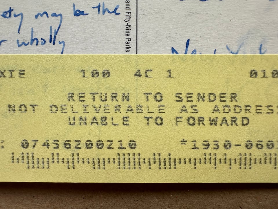 detail of postcard with a Return To Sender sticker from the USPS