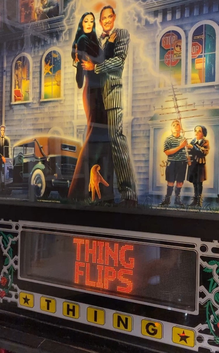 Picture of the backbox of The Addams Family pinball machine.
