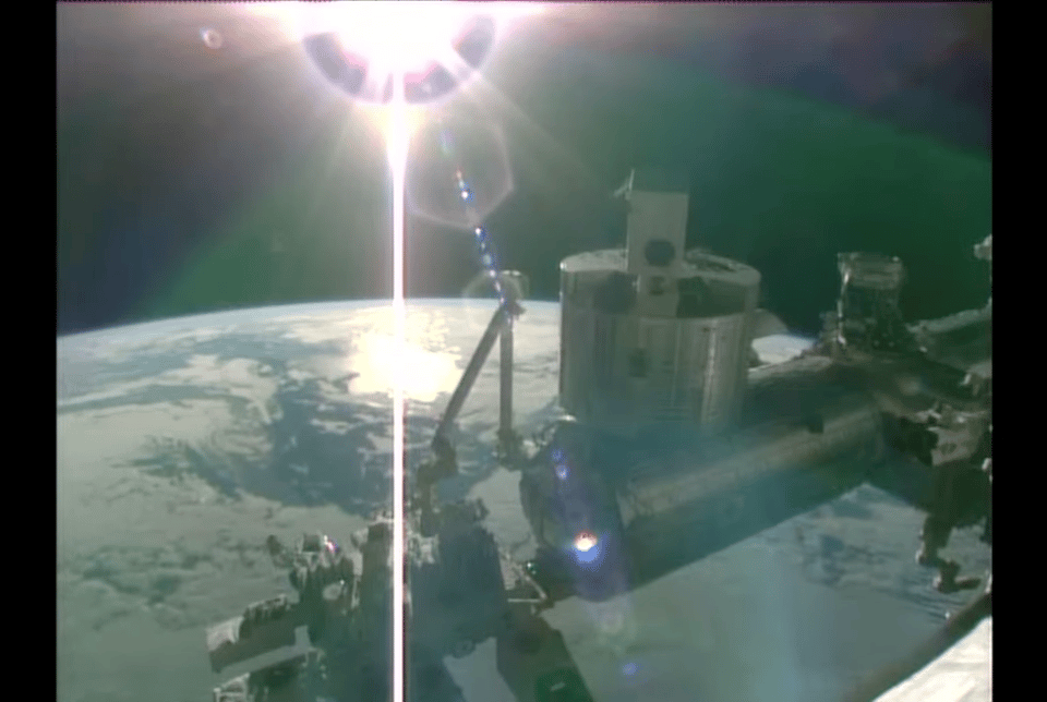 Image captured from the live ISS Nasa video. It shows part of the station with the Earth in the background and the sun at the top.