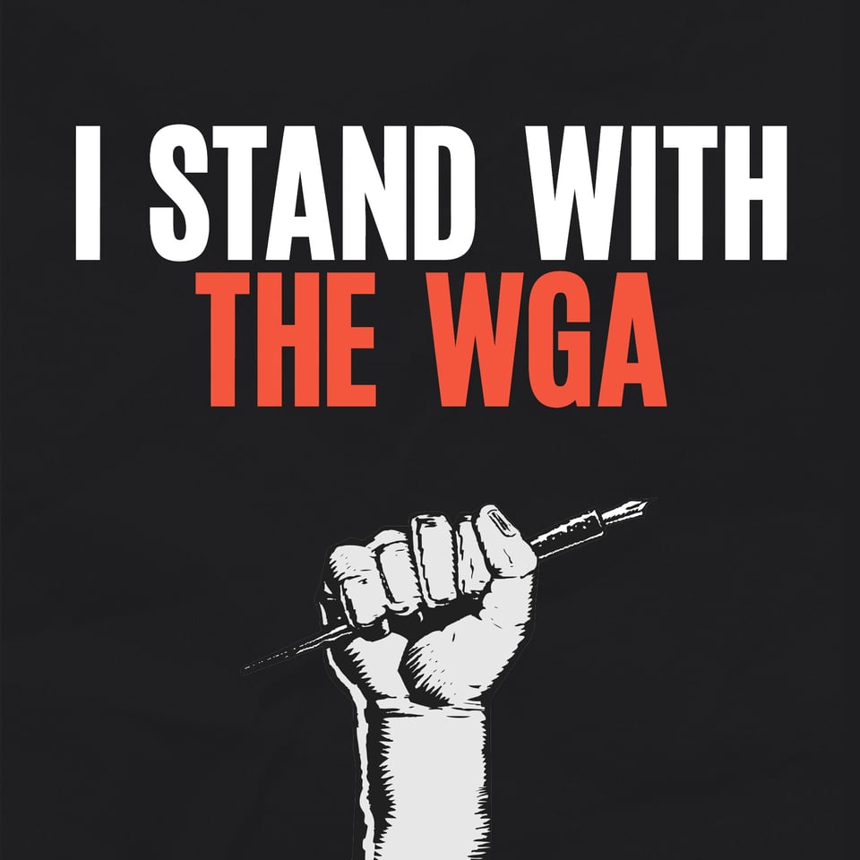 A raised fist holding a pen, proclaiming "I stand with the WGA."