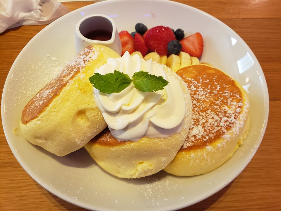 A giant stack of souffle pancakes.